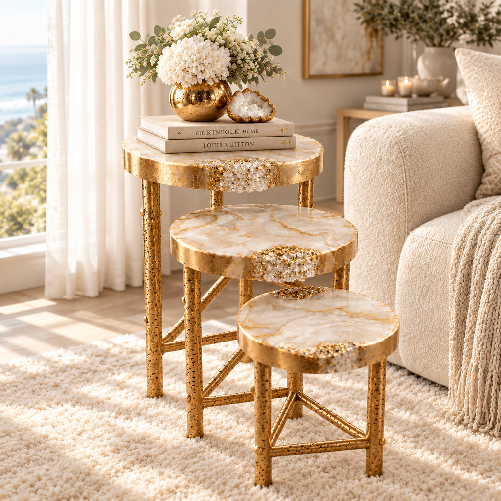 Three-tiered decorative nesting tables with marble-like top and gold frame on a white background