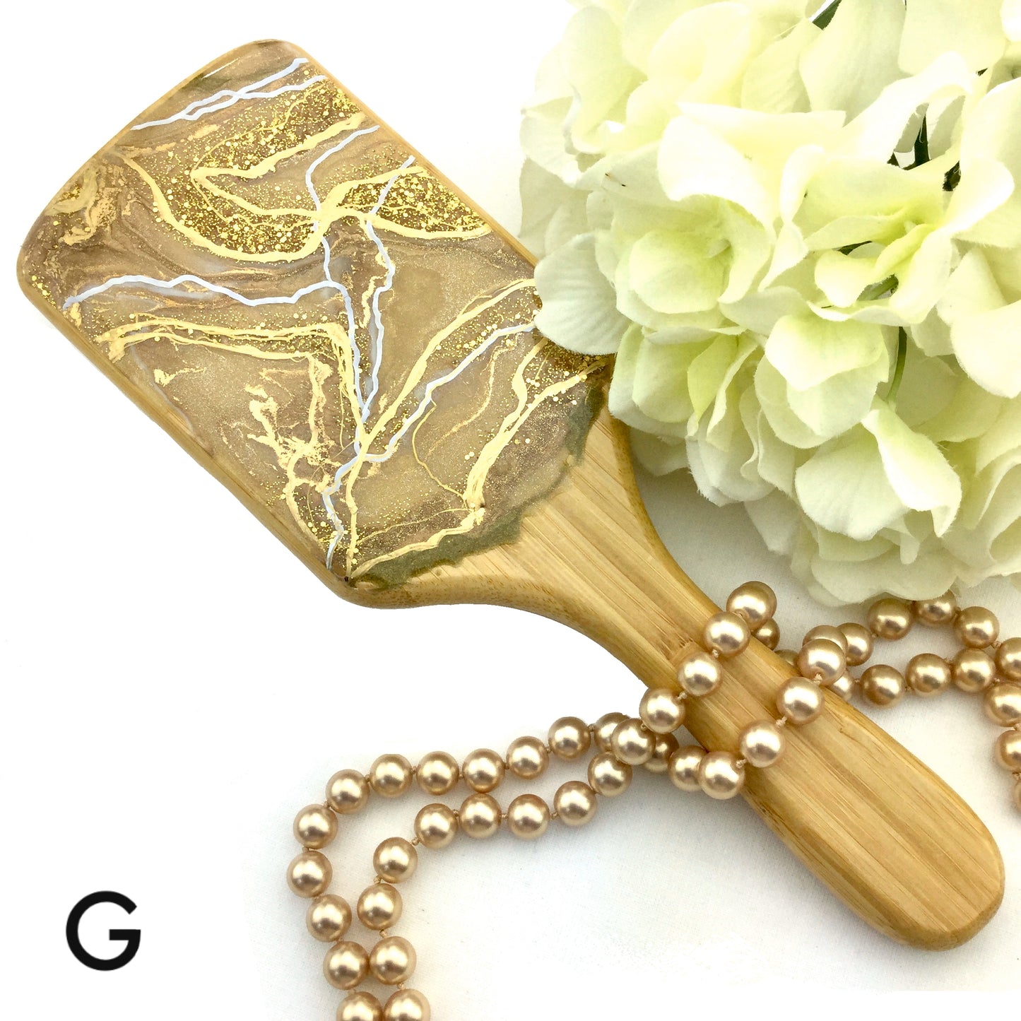 Champagne with gold and white resin art on detangling hairbrush - Mamota Creative