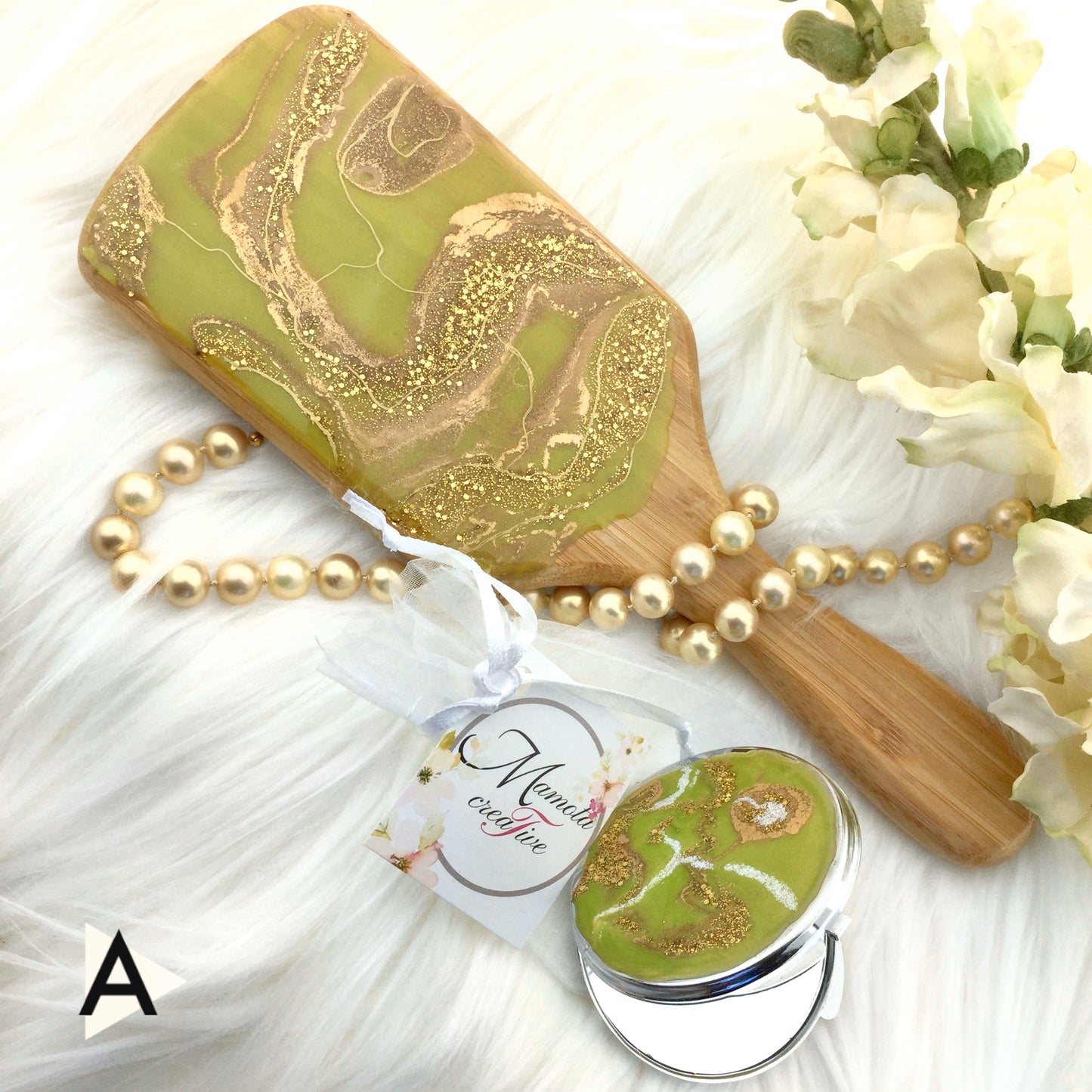 Green and gold tones resin art on detangling spa hairbrush - Mamota Creative