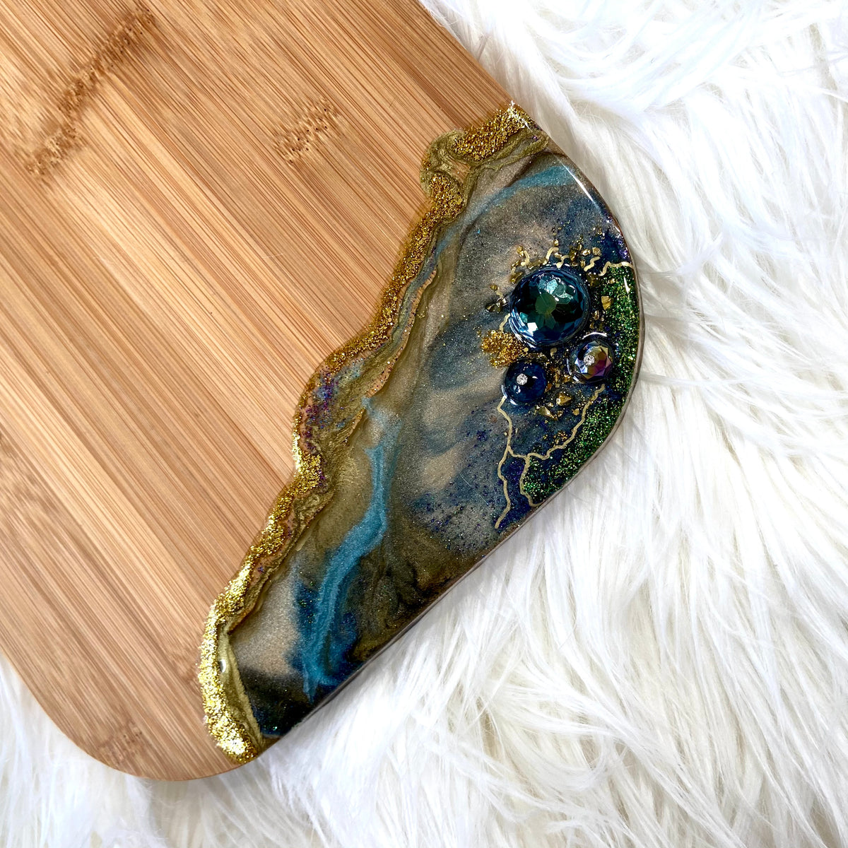 Handcrafted Peacock Royale XL bamboo serving board with decorative brass peacock