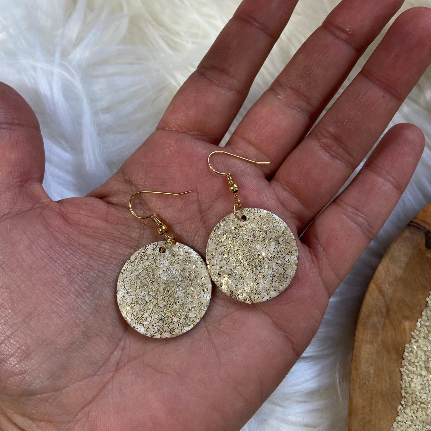 Pair of sparkling sand round resin earrings with gold-plated fishhook earwires