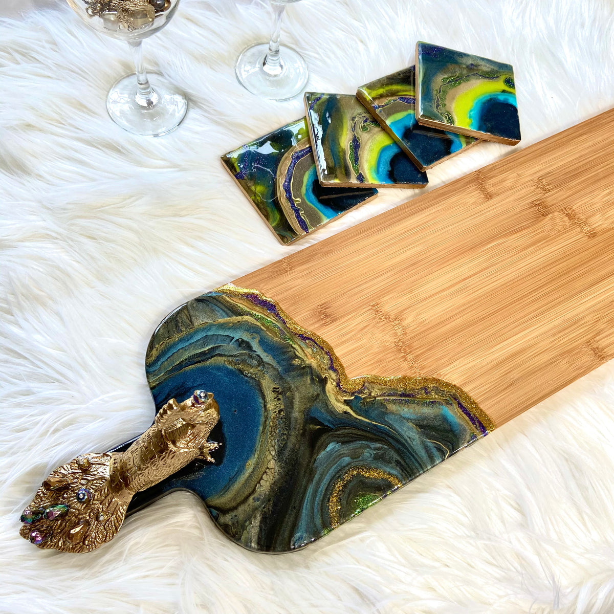 Peacock Royale XL serving board with colorful resin design and brass peacock accent
