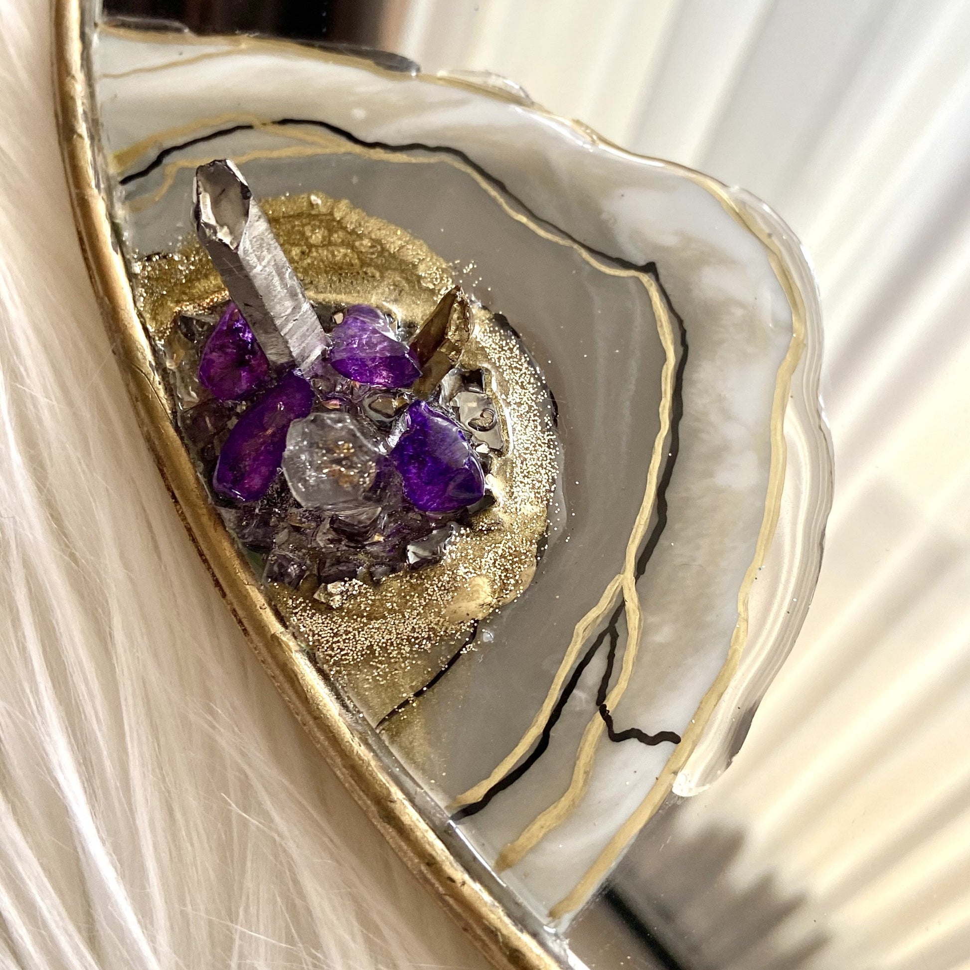 A close up of the quartz cluster on Luxnu mirror - Mamota Creative