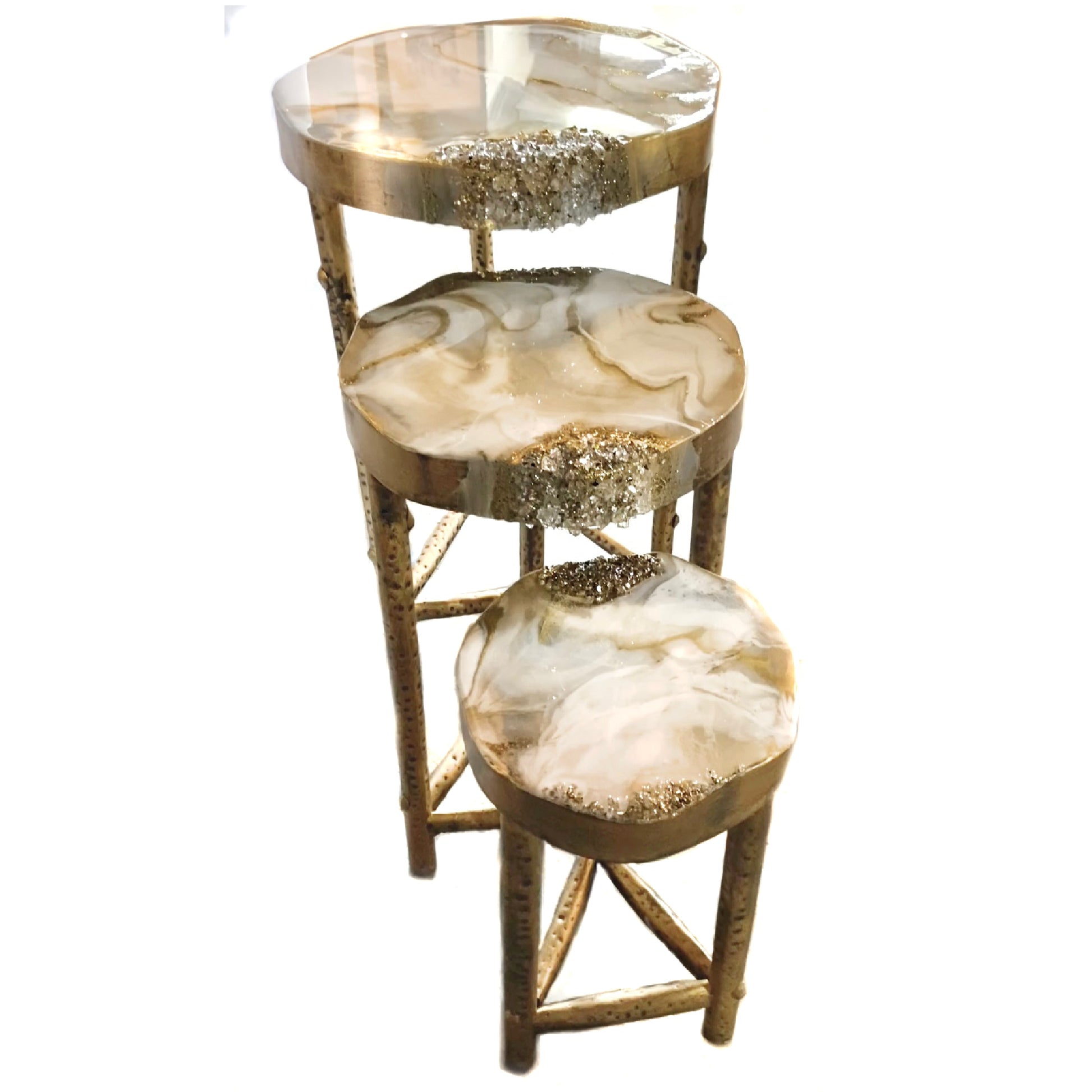 Three-tiered decorative nesting tables with marble-like top and gold frame on a white background