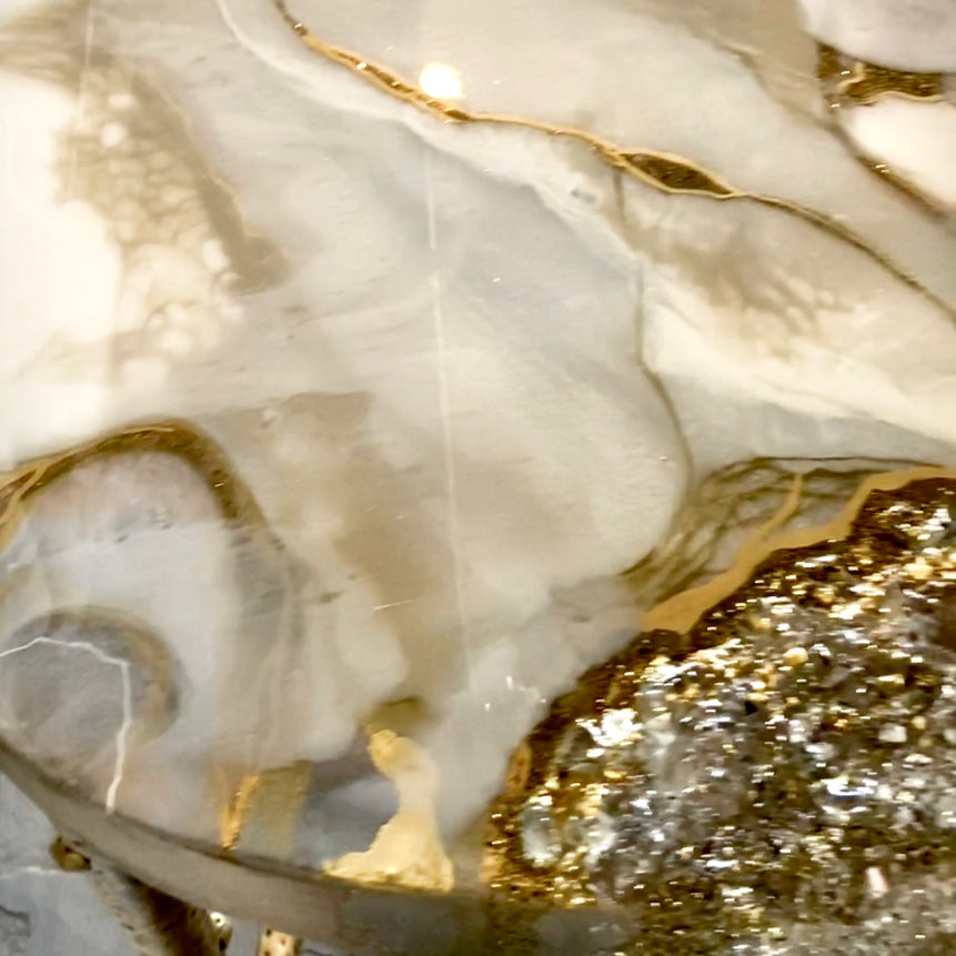 Close-up of a marble surface with gold veins