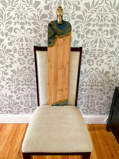Handcrafted resin art and beaded peacock detail on the bamboo serving board