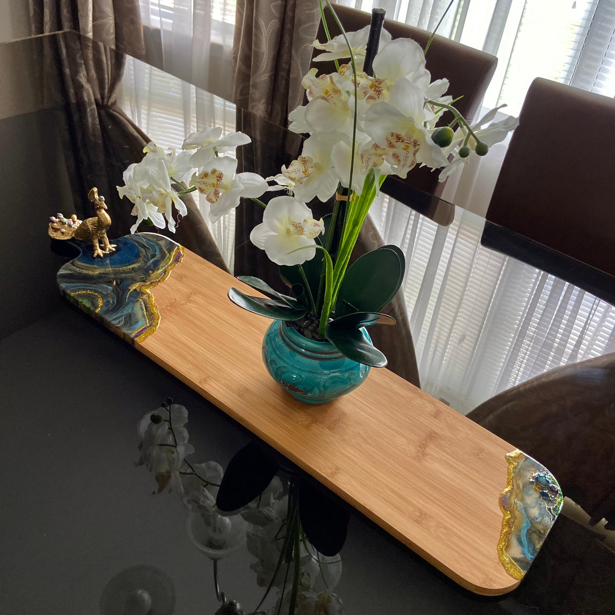 Long bamboo serving board decorated with colorful Peacock Royale resin art