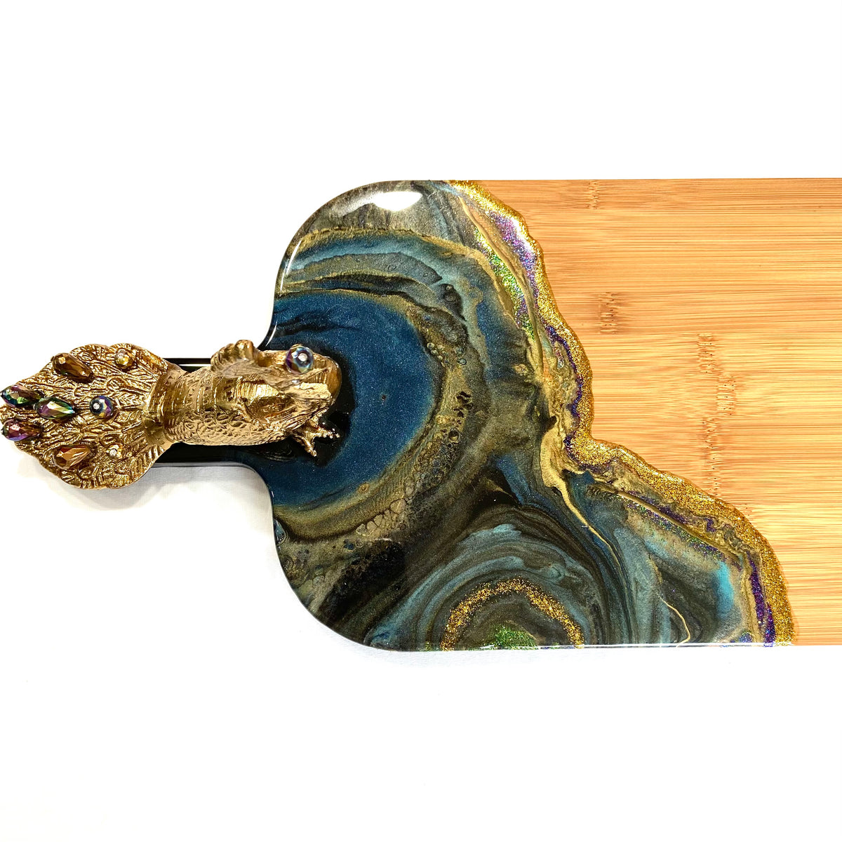 Decorative detail of the Peacock Royale XL bamboo serving board