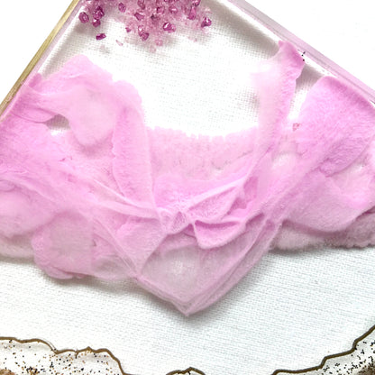 Close up view of resin ribbons on pink and clear geode coasters - Mamota Creative